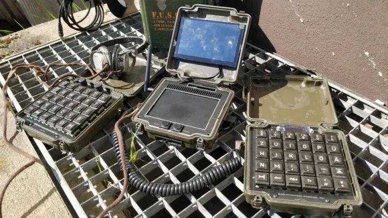 A computer with Raspberry Pi that looks like it came out of a war