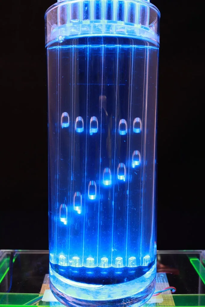 Glowing Air-Bubble Clock in Water