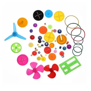 Assorted set of coloured plastic motor gears with propellers, pulleys and accessories