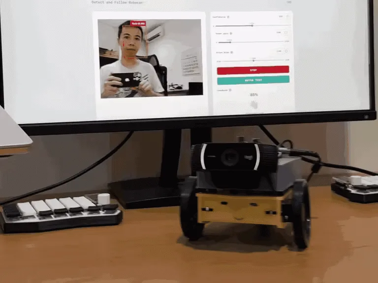 Photo of the face-following robot built with Arduino UNO Q, showing the webcam and servomotors